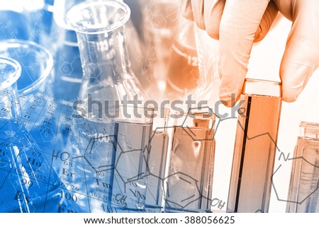 Chemist \'s gloved hand holding the test tube at laboratory, with chemical equations and periodic table background.