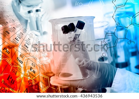 Scientific concept, gloved hand hold a beaker in laboratory room with periodic table and chemical structure background