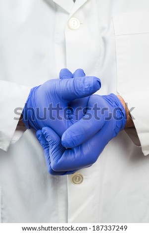 Doctor hands with blue gloves ready for examination