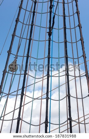 Marine rope ladder at pirate ship. Sea hemp ropes on the old nautical vessel. Ladder upstairs on the mast.