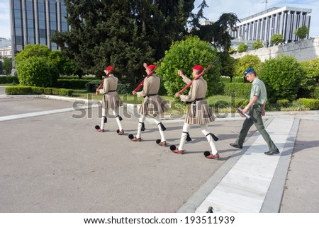 ATHENS, GREECE - MAY 15: Evzones changing the guard at the Tomb of the Unknown Soldier in front of the Greek Parliament Building at Syntagma Square on May 15, 2014 in Athens,Greece.