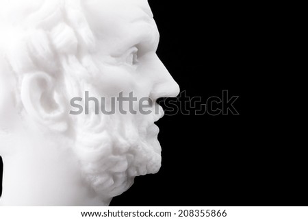Greek philosopher Democritus (460-370 B.C.E.) sculpture isolated on black background