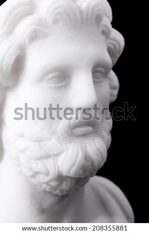 Statue of ancient Greek god of medicine and healing Asclepius, isolated on black background