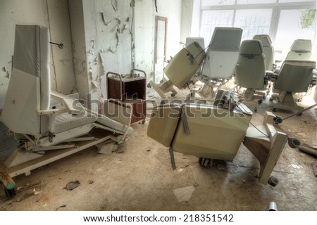 Interior of an abandoned building with rubble and debris. Deserted old hospital