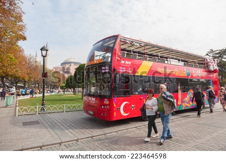 ISTANBUL - OCT 7: Sight seeing tourist bus in front of Hagia Sophia on October 7, 2014 in Istanbul. Sultanahmet Square one of the most popular travel destination in Turkey.