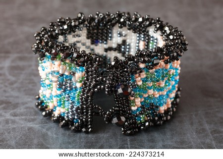 Jewelry made from beads. Bracelet on a dark surface