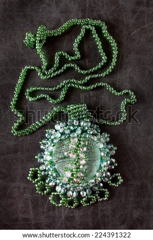 Jewelry made from beads. Bead Necklace on a dark surface.