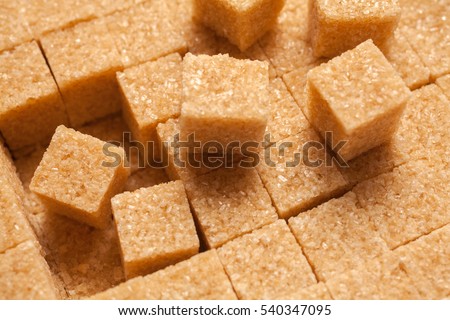 Brown sugar cubes. Food background
