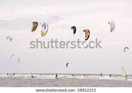 ST. PETER-ORDING, GERMANY - JULY 22: Professional  kite-surfers demonstrate their ability on the Palmolive Kitesurf Worldcup 2010 in St. Peter-Ording, July 22, 2010 in St. Peter-Ording, Germany
