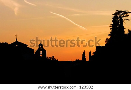 view of the roofs of the roman forum at sunset