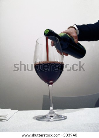 waiter pouring Red Wine,- very soft focus