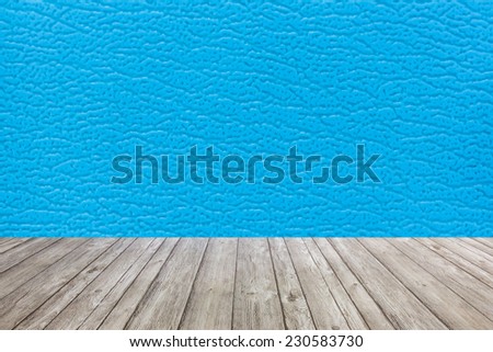 Blue Surface of the sofa made of artificial leather with wood floor background