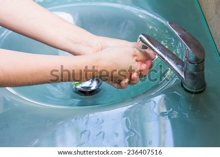 washing hand and turn off faucet out door