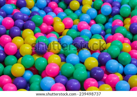 Many colorful plastic balls on children's playground