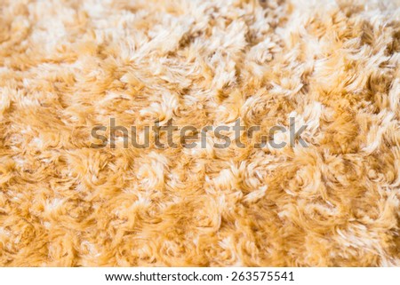 Close up of brown Faux fur fabric synthetical texture background