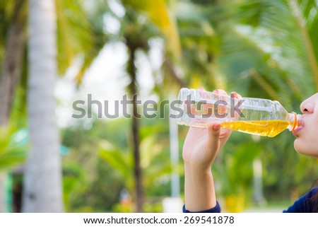 Woman Drinking Green Tea Outdoors. Summer Background. with green bokeh