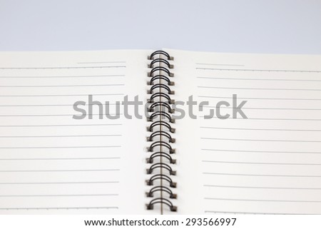 close up of blank white book on white background