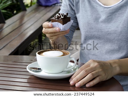 Brownies and coffee on wooden table
