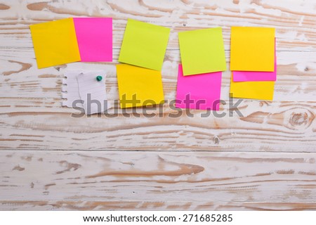 Post it, sticky note on wood board, empty space for text