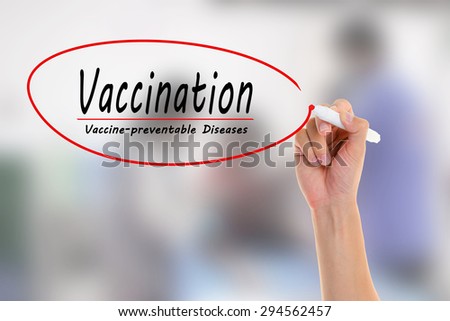 Doctor hand  writing Vaccination ,vaccine-Preventable Diseases in the visual screen. on blurred of vaccine injection.