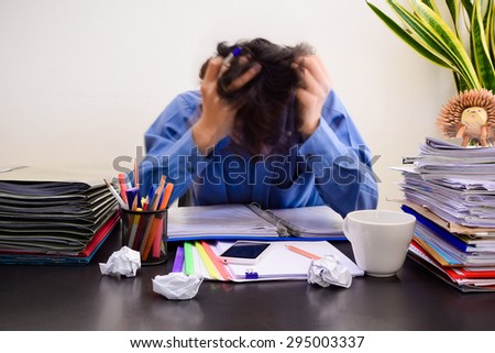 Business man in office with burnout syndrome at desk (motion blur business man Concept for stress or tension)