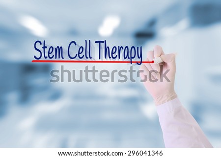 Doctor write Stem Cell Therapy  on visual screen in blurred medical lab room.