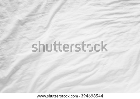 Top view of wrinkles fabric sheet unmade bed
