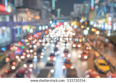 Defocused lights car traffic jam of a street road at night retro color effect for background