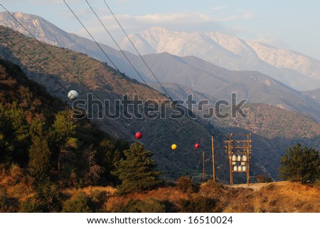 stock-photo-large-power-line-with-marker-balls-travels-through-the-mountains-16510024.jpg