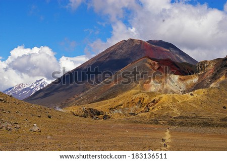The three sisters of the Tongariro crossing standing side by side on New Zealand\'s north island, raked the top one day walk in New Zealand. In the center lies Mt Doom famous from The Lord of the Rings