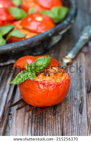 Stuffed tomatoes on the rustic dish