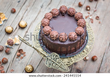 Home made whole chocolate cake with chocolate icing and famous italian chocolates