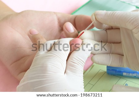 Doctor testing for blood group