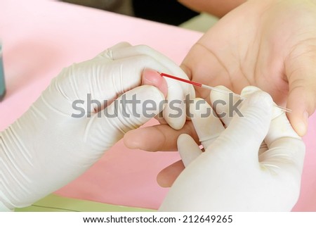 Doctor testing for blood group