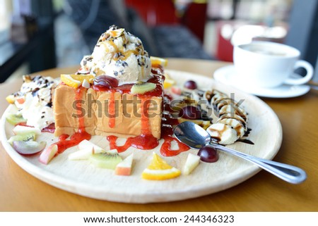 Strawberry honey toast with whipped cream,ice cream and mix berry