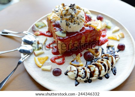 Strawberry honey toast with whipped cream,ice cream and mix berry