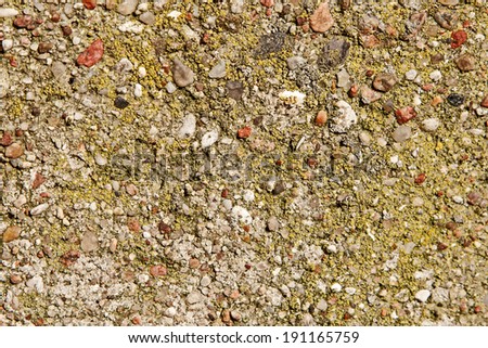 The photograph shows the old ledge of concrete and small stones