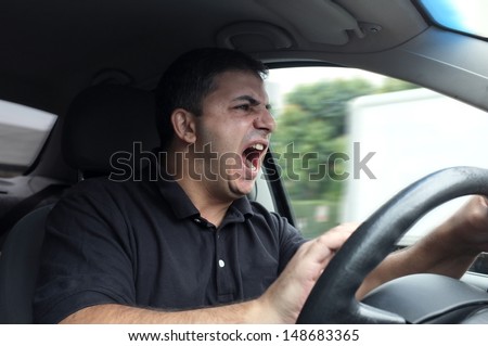 Angry Man Driving A Vehicle Without Seat Belt