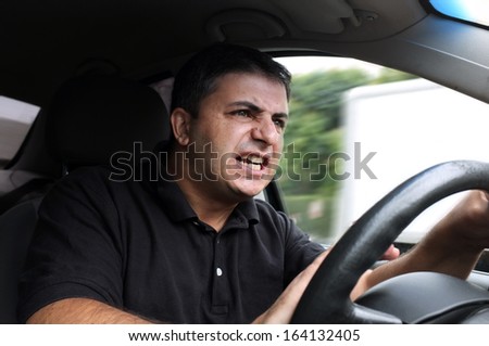 angry man driving a vehicle without seat belt