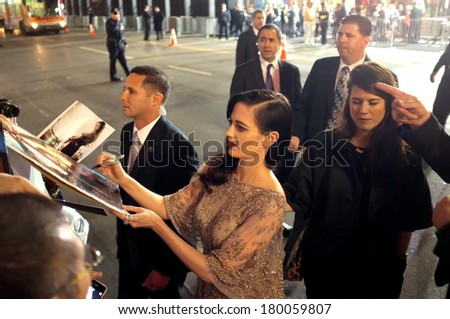 LOS ANGELES - FEBRUARY 4: Actress Eva Green signs autographs at the premiere of 300: Rise of an Empire at the TCL Chinese Theatre, Hollywood on February 4, 2014