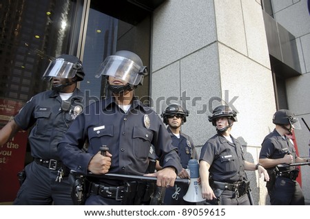 LOS ANGELES - NOVEMBER 17: Riot police stand guard outside a building of Bank of America during a Occupy LA rally on November 17, 2011 in Los Angeles, CA.