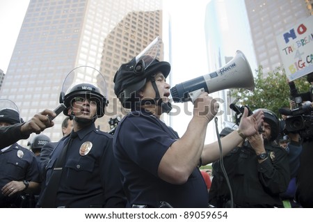 LOS ANGELES - NOVEMBER 17: Police officer\'s  reportage at Occupy LA protesters march in Los Angeles on November 17, 2011.