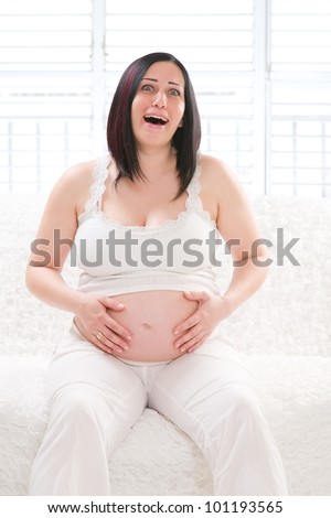 Pregnant woman screams in pain in the abdomen