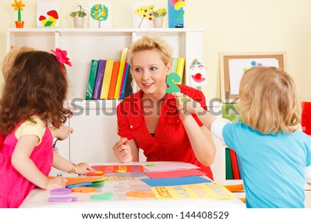 pre-school children in the classroom with the teacher