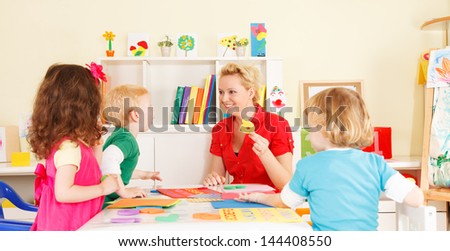 pre-school children in the classroom with the teacher