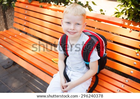 School boy in anticipation of the first school day