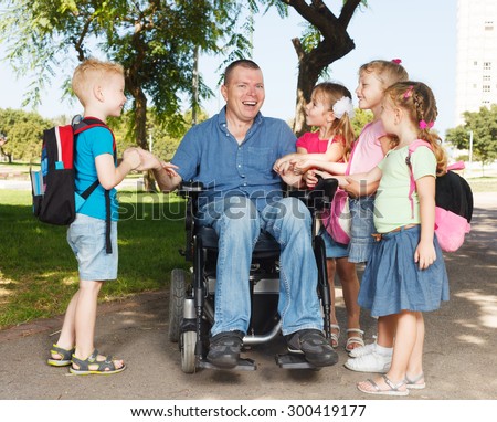 Disabled father with children showing unity