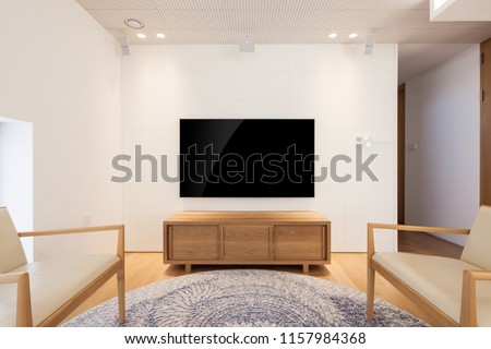 uhd 65 inch tv in a white indoor