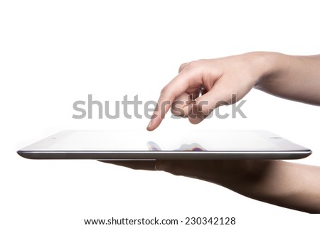 A female(woman, girl) hand support tablet pc device and finger touch the screen isolated white at the studio.