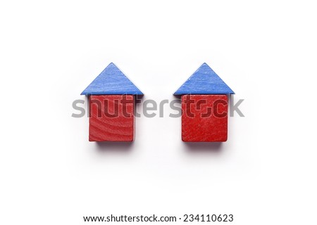 the red and blue wood blocks like house(real estate) isolated white, top view at the studio.